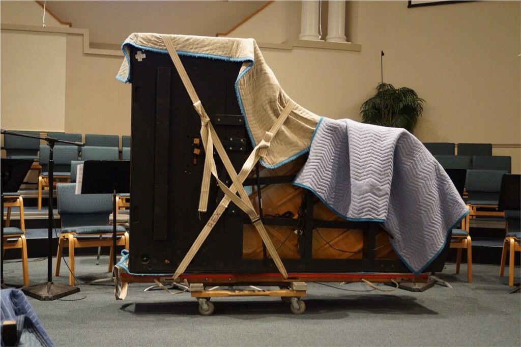 A properly packaged piano ready to be moved.