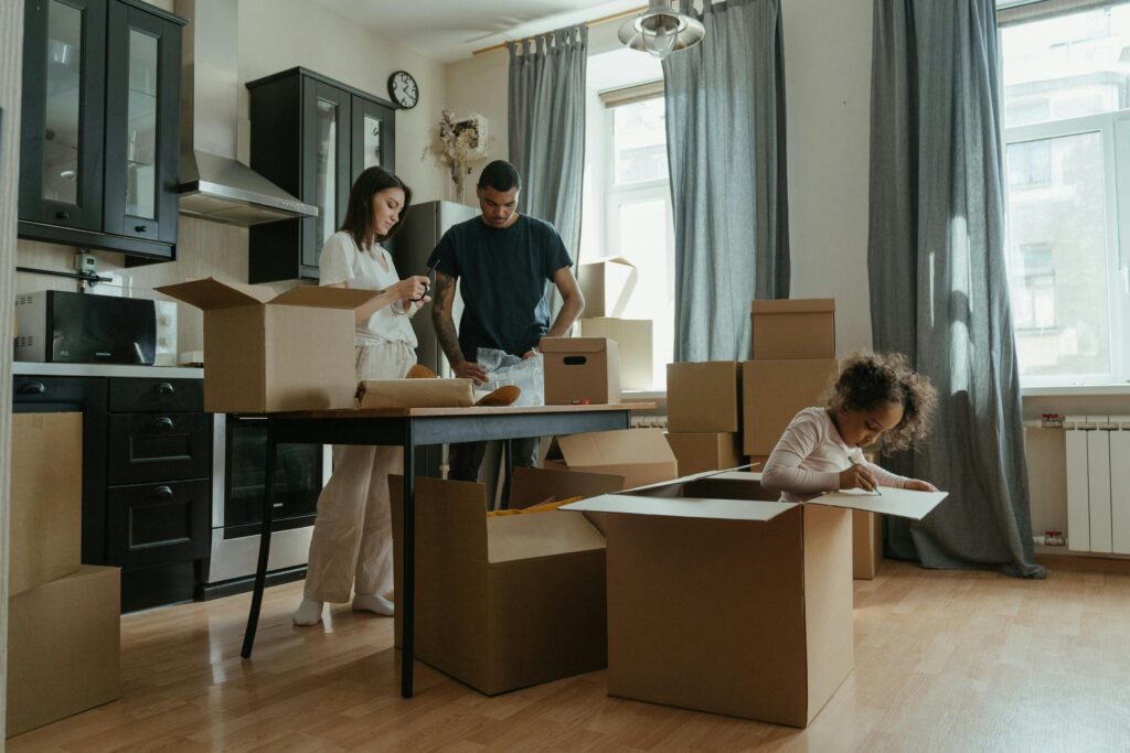 Smiling family ready to move, checklist ready to be reviewed.