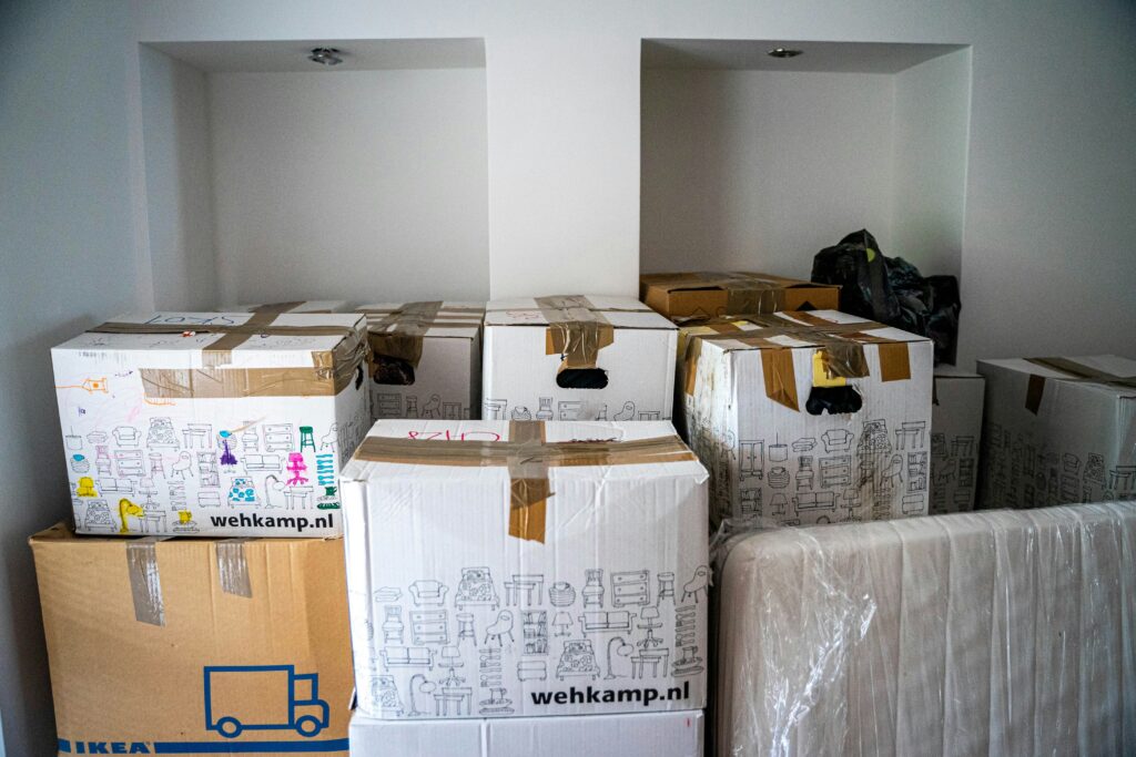 Packed boxes containing belongings ready to be moved.