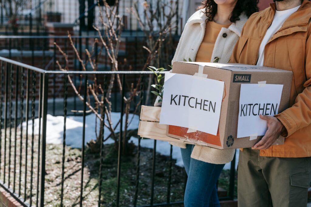 A couple moves to a new home with confidence with properly labeled boxes.