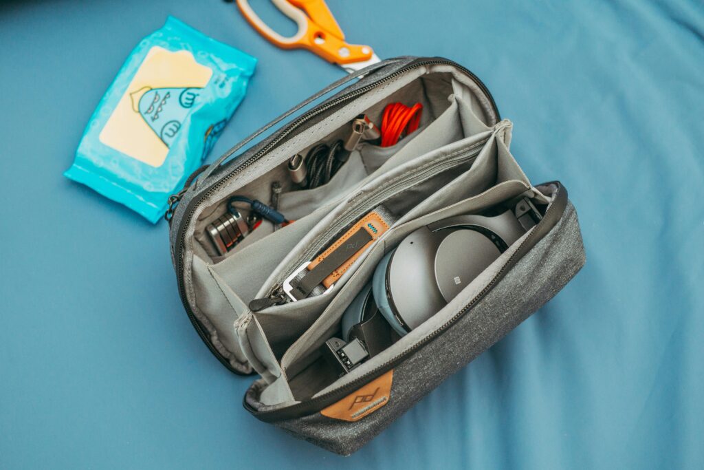 Build one essentials bag per person. Before more boxes are sealed, set aside the items you will need right away.