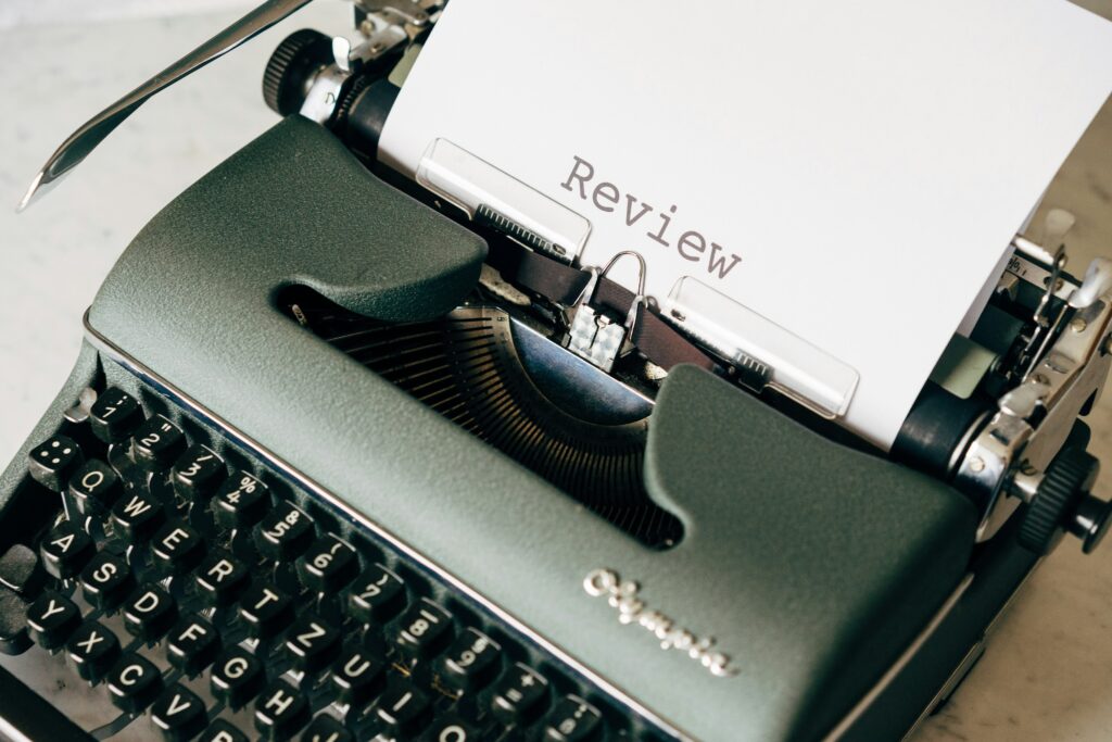 Typewriter typing a review letter.
