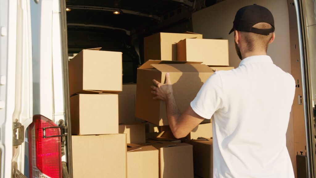 Same day mover packs belongings safely into moving van.
